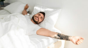 man waking up well rested in morning